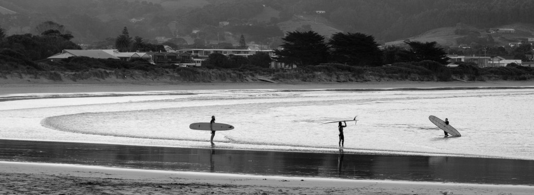 Longboarders at sunset Apollo Bay